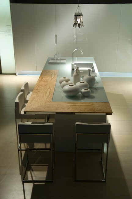 the dining table is in the center of the action in the kitchen, Contemporary Kitchen by Aster Cucine - new Ulivo - Luxury and Modern Kitchen with stylish design