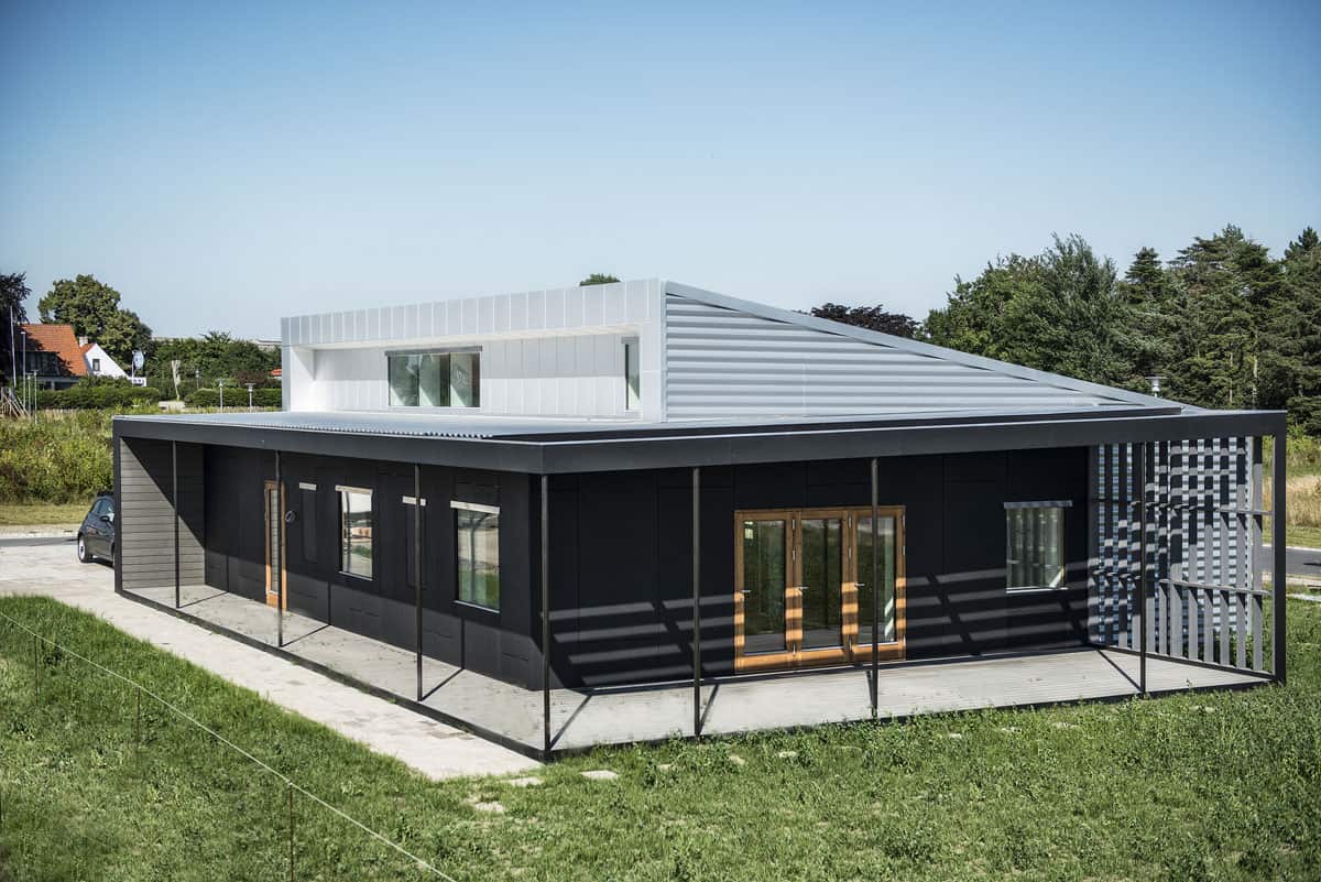 Upcycle House: Two Prefabricated Shipping Containers, Recycled Soda 