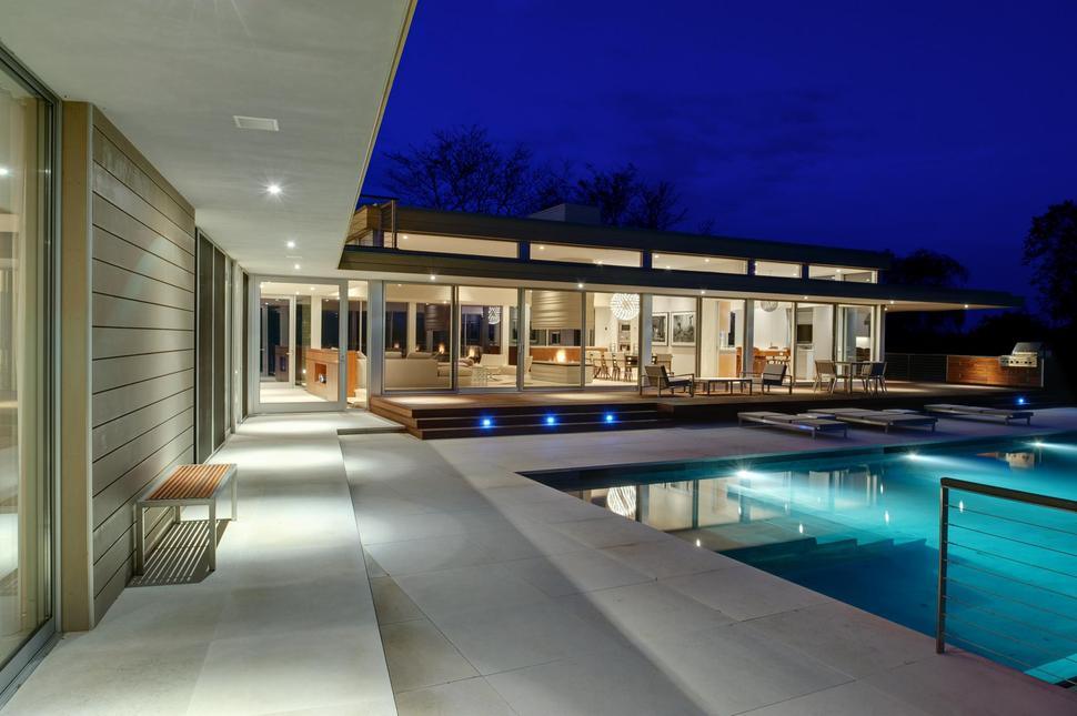 Energy Star Home Flanked by Pool & Pond | Modern House Designs