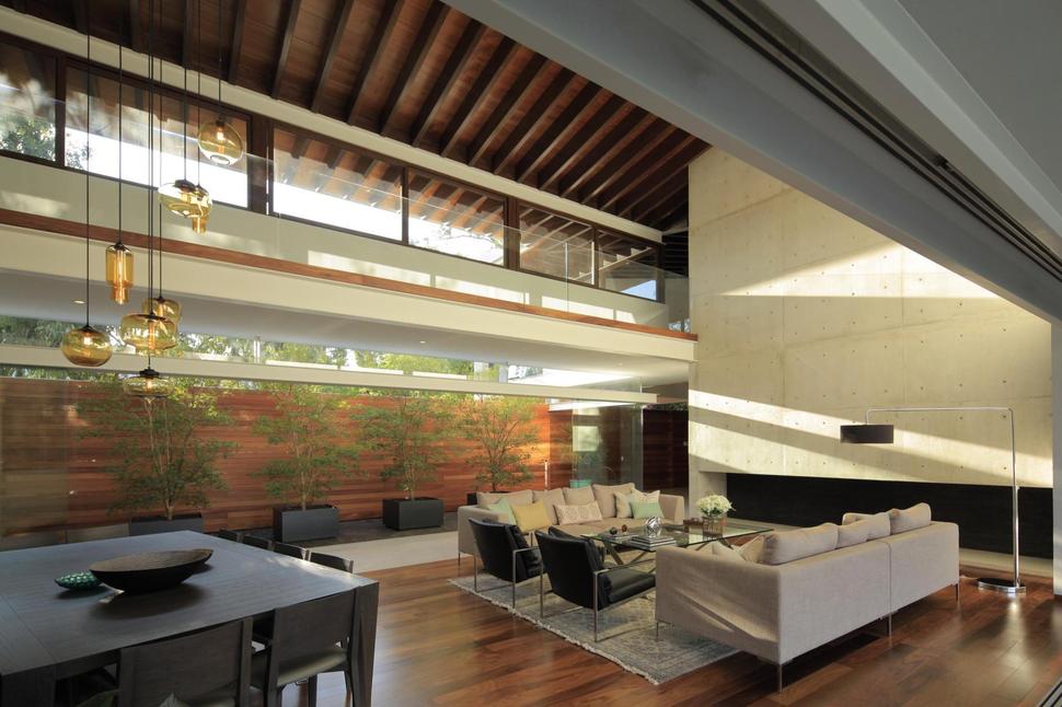 casa-siete-opens-wide-front-back-false-façade-11-living-dining.jpg