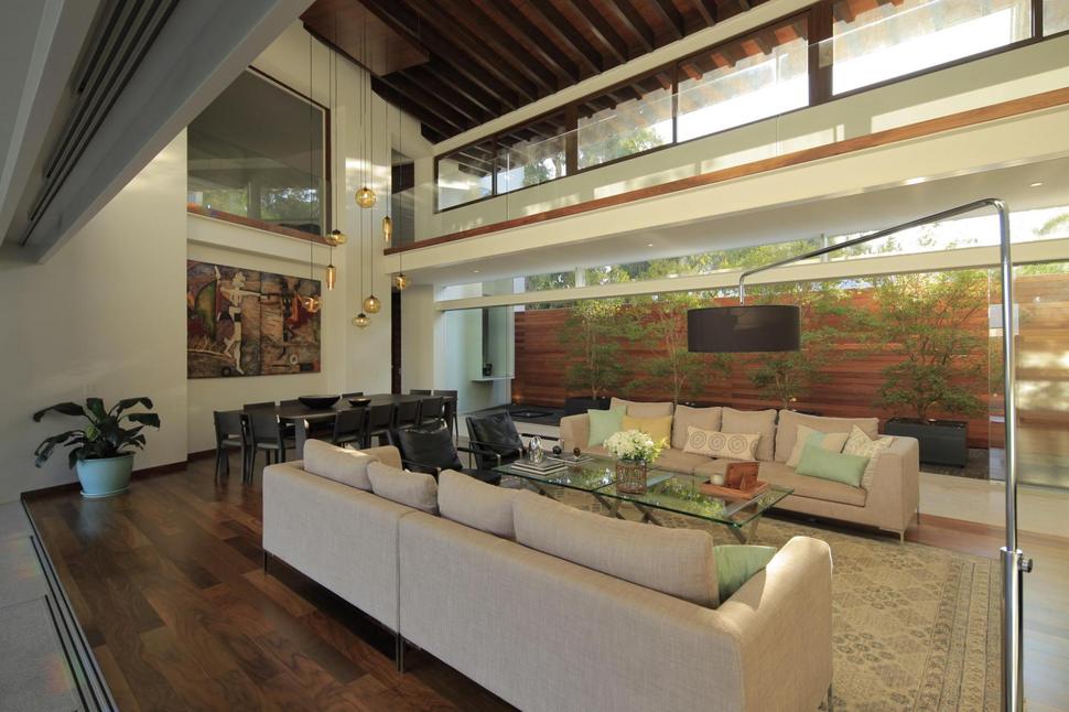 casa-siete-opens-wide-front-back-false-façade-12-living-dining.jpg