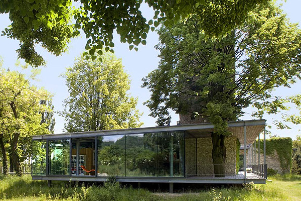  Modern Glass Home in Krakow, Poland comes with a tree and a tower!